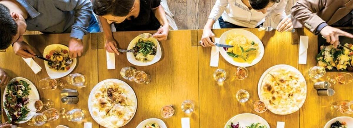 group of people eating at a table