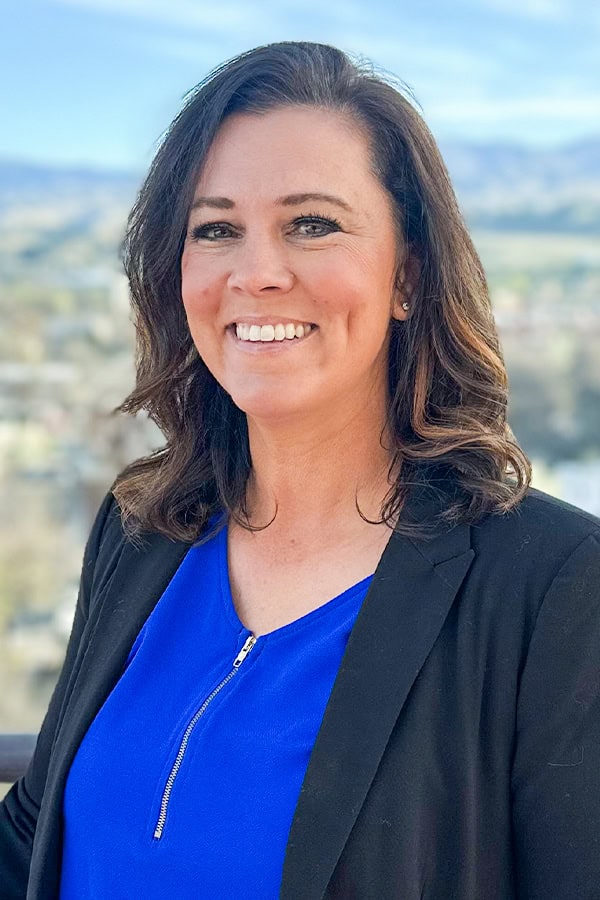 Portrait of Laura McCauley, real estate professional and property specialist.