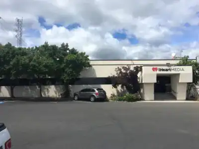 Exterior view of CR Spokane office building with parking lot and trees.