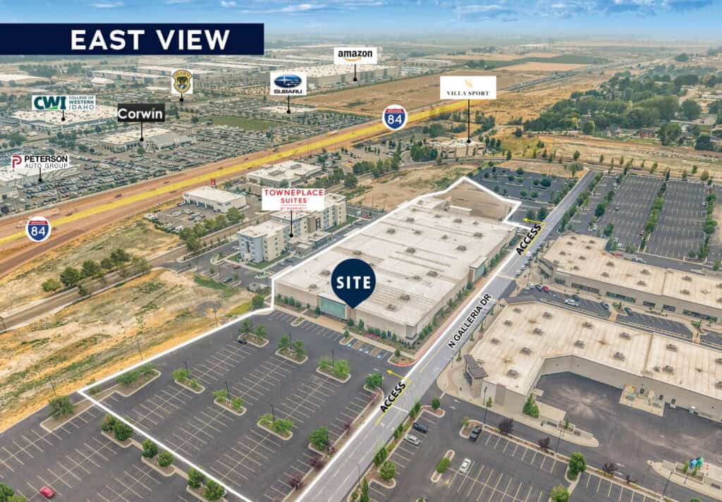 Aerial view of Nampa industrial site near I-84 with surrounding businesses and parking lots.