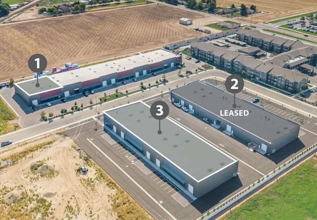 Aerial view of Cherry Lane Industrial, a new-construction, three-building industrial park in Nampa, Idaho, with modern warehouse buildings and surrounding development.